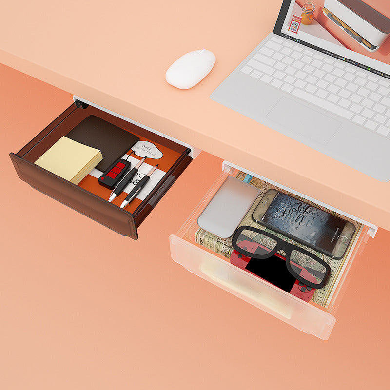Sous le tiroir du bureau