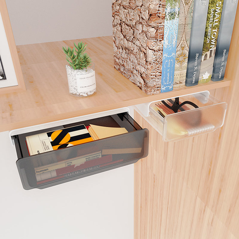 Sous le tiroir du bureau