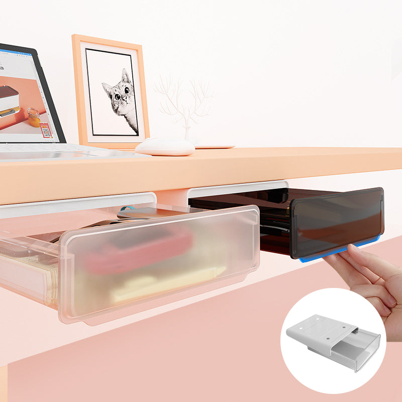 Sous le tiroir du bureau